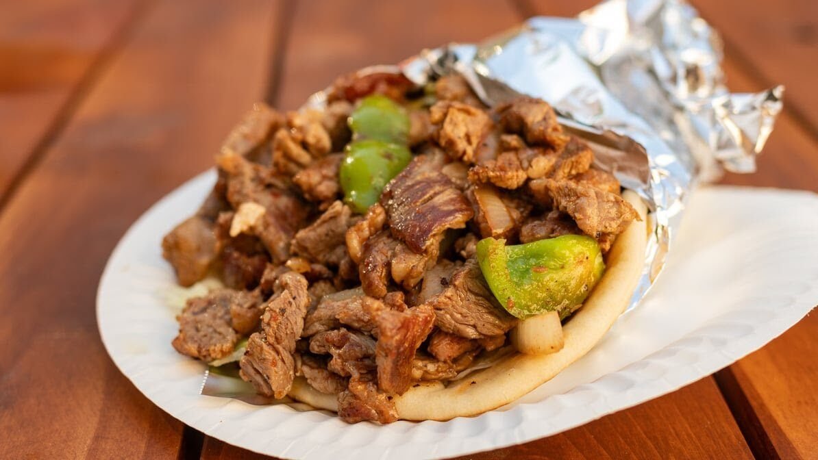 Fresh gyro packed with meat, vegetables and sauce