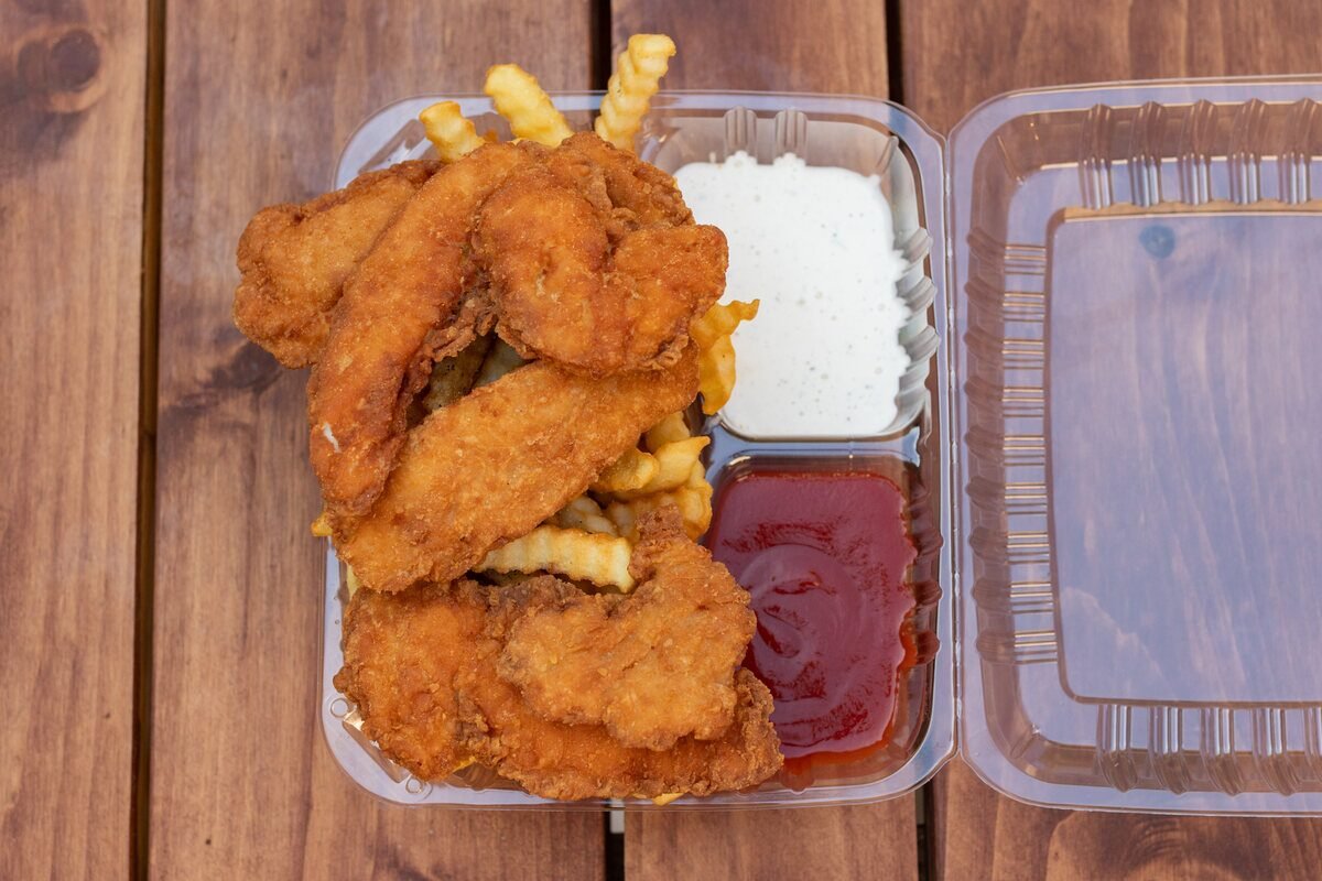 Chicken strips meal with fries and a drink
