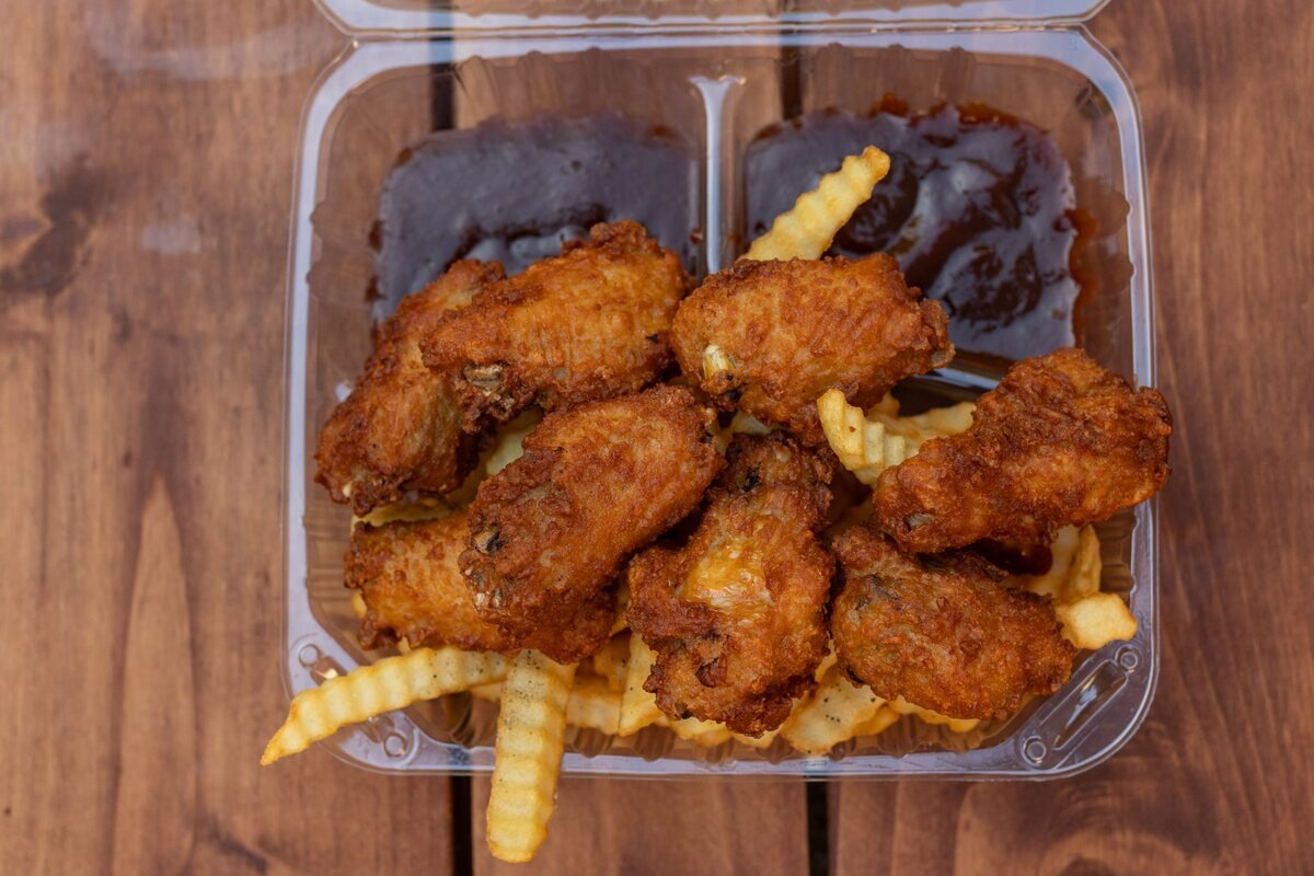 Chicken wings meal with fries and a drink