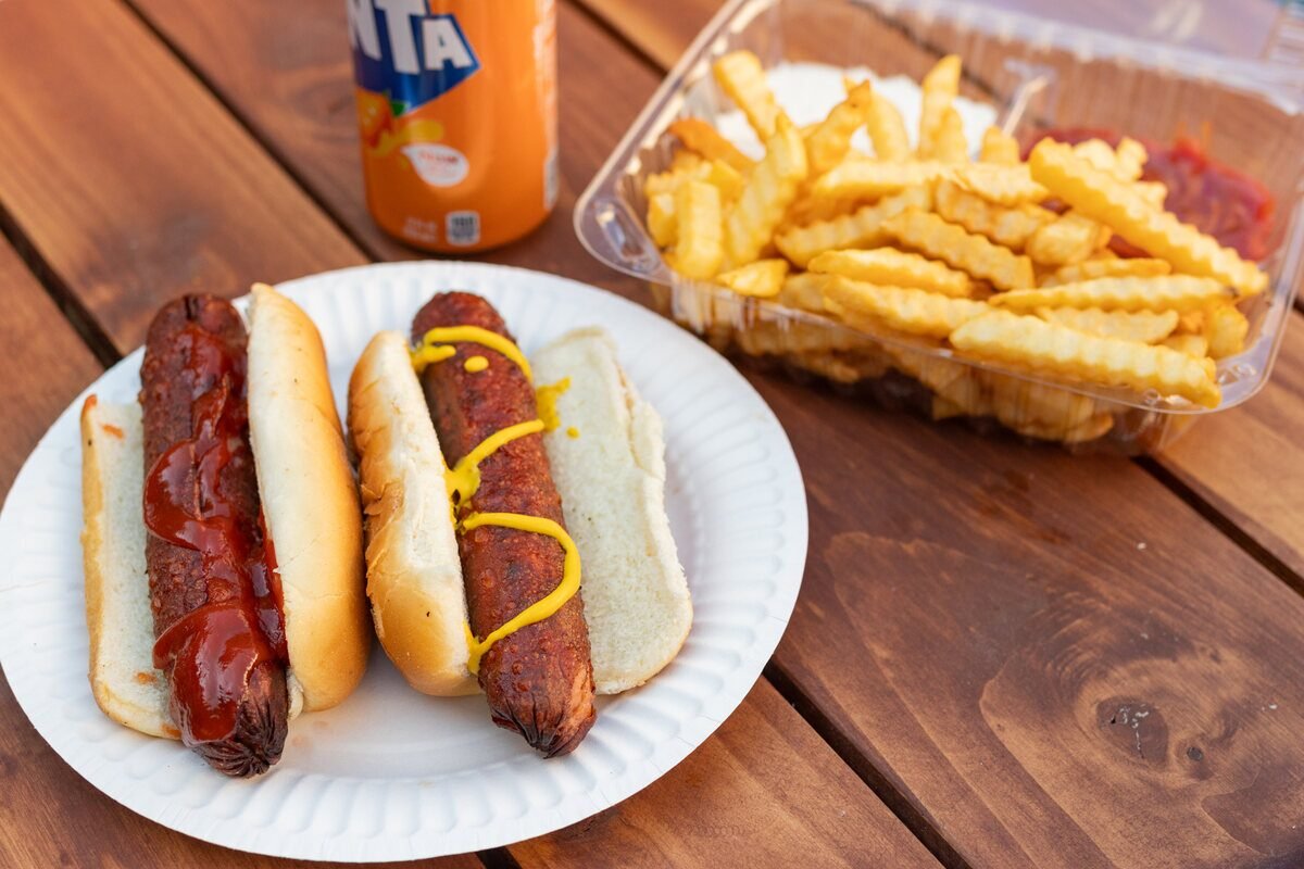 Hot dog meal with fries and a drink