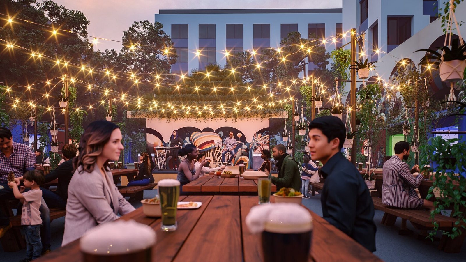 Guests dining beneath glowing string lights at Midtown Beer Garden